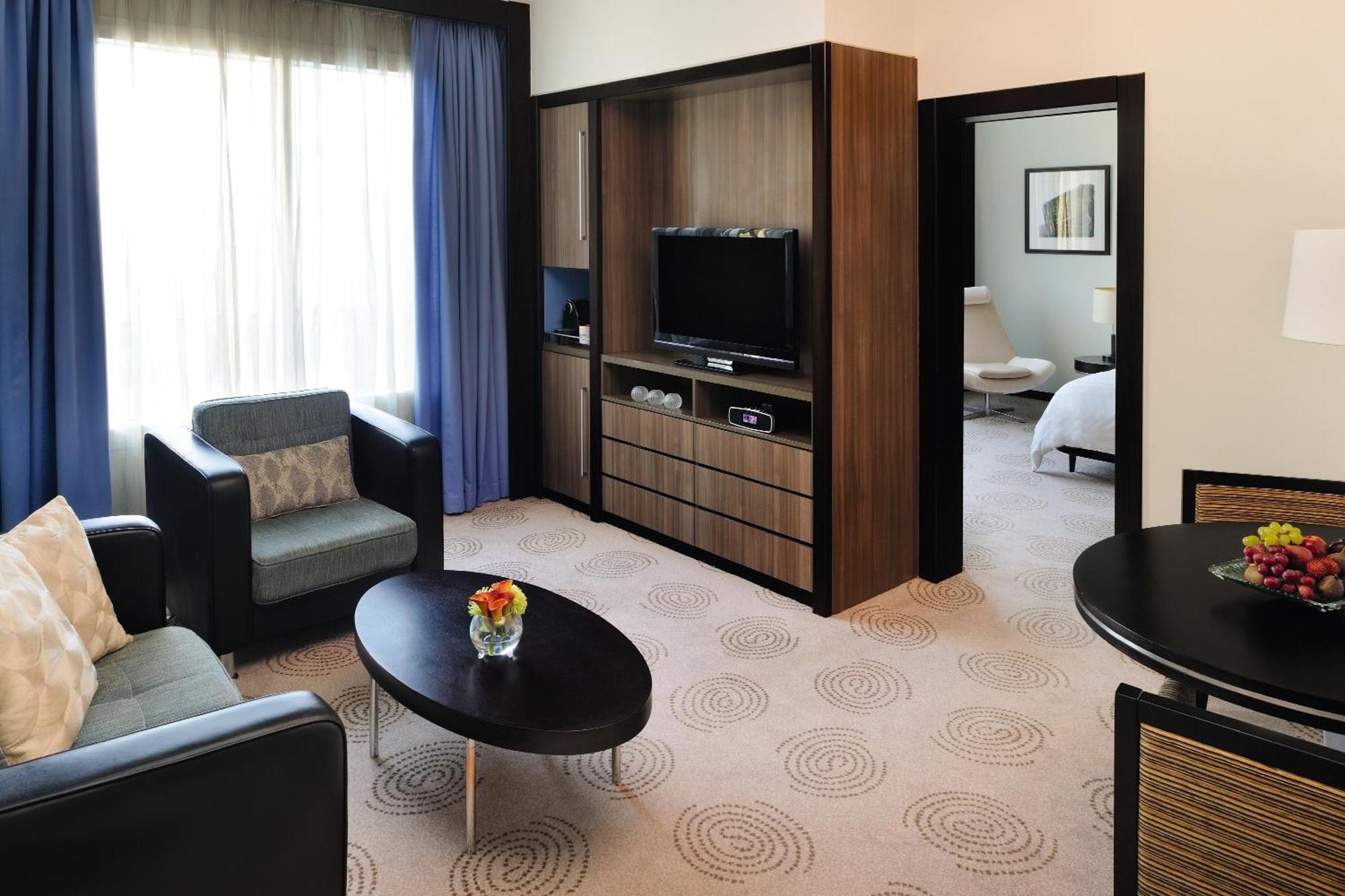 AVANI Executive Suite Living & Dining Area Early Check & Late Check-Out Happy Hours Section Rooftop Pool Access