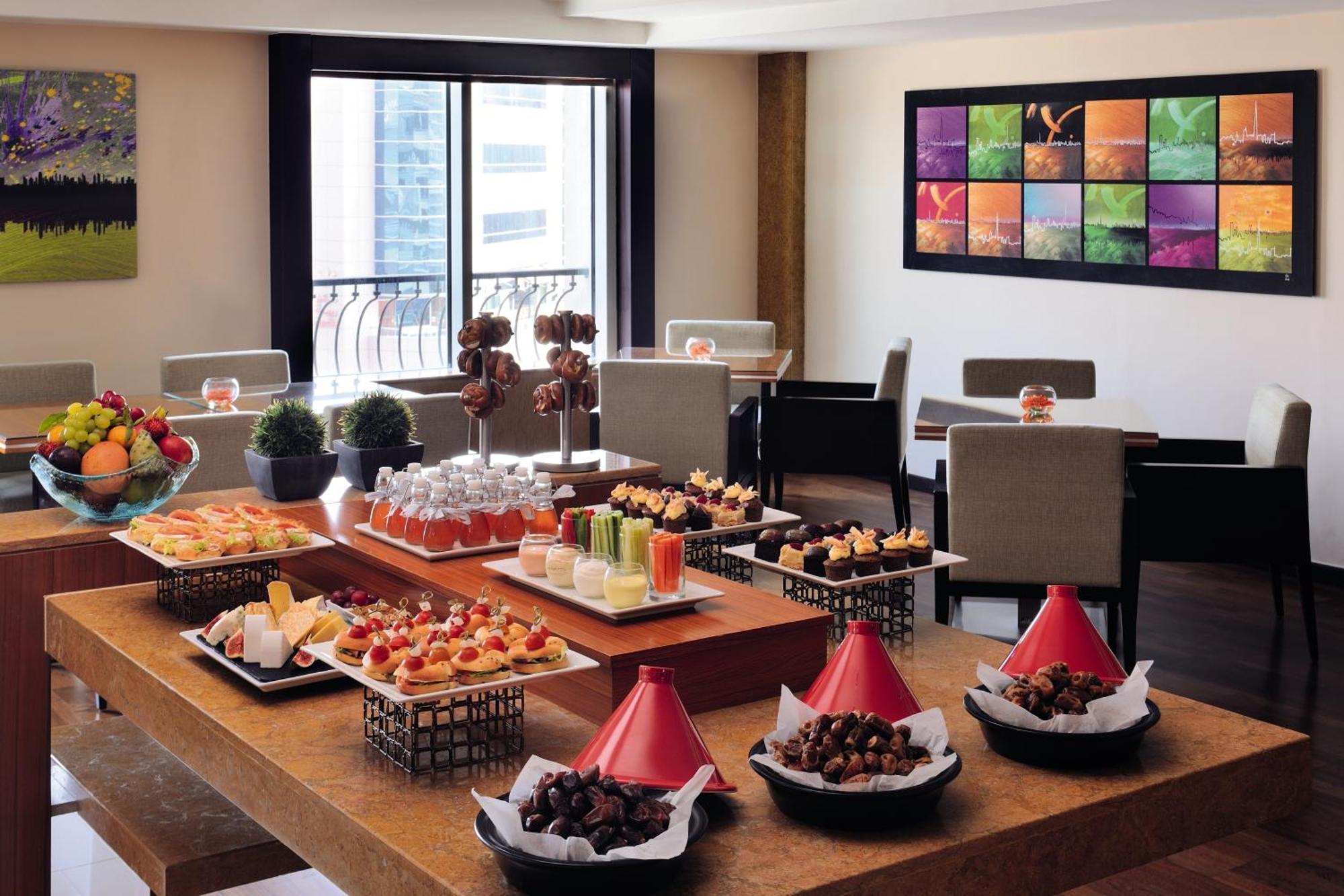 AVANI Executive Suite Living & Dining Area Early Check & Late Check-Out Happy Hours Section Rooftop Pool Access